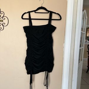 Ties in front on thighs , can be really short if tied too tight